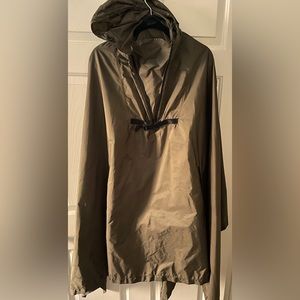 Prada Raincoat that transforms into a carry bag.